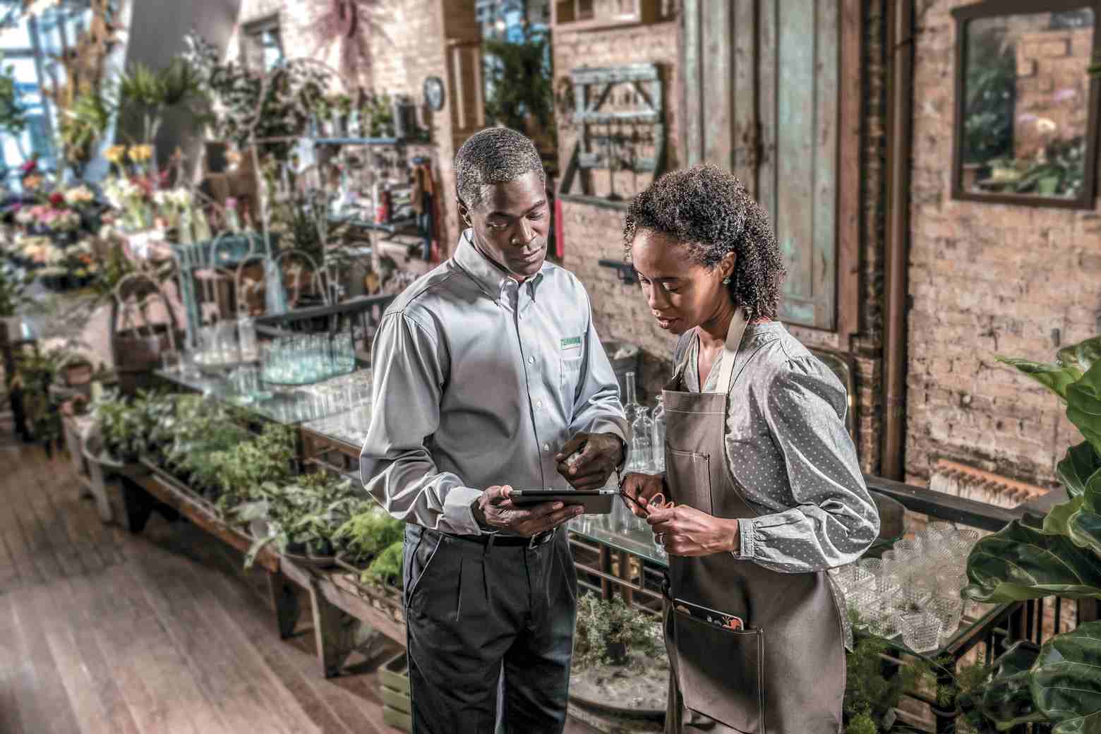 terminix technician and woman talking